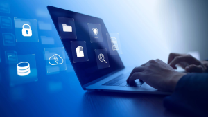 Hands typing at a computer